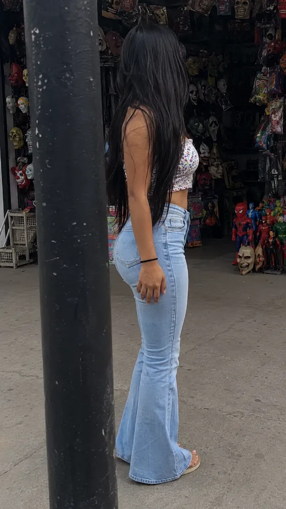 woman in street, shown with smartphone-style photo styling.