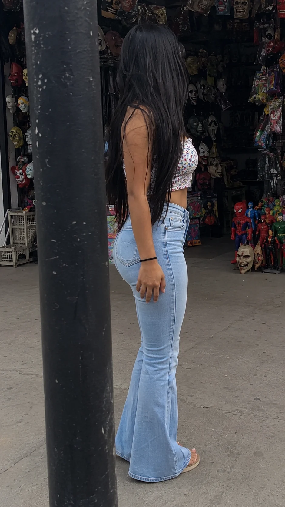 woman in street, shown with smartphone-style photo styling.
