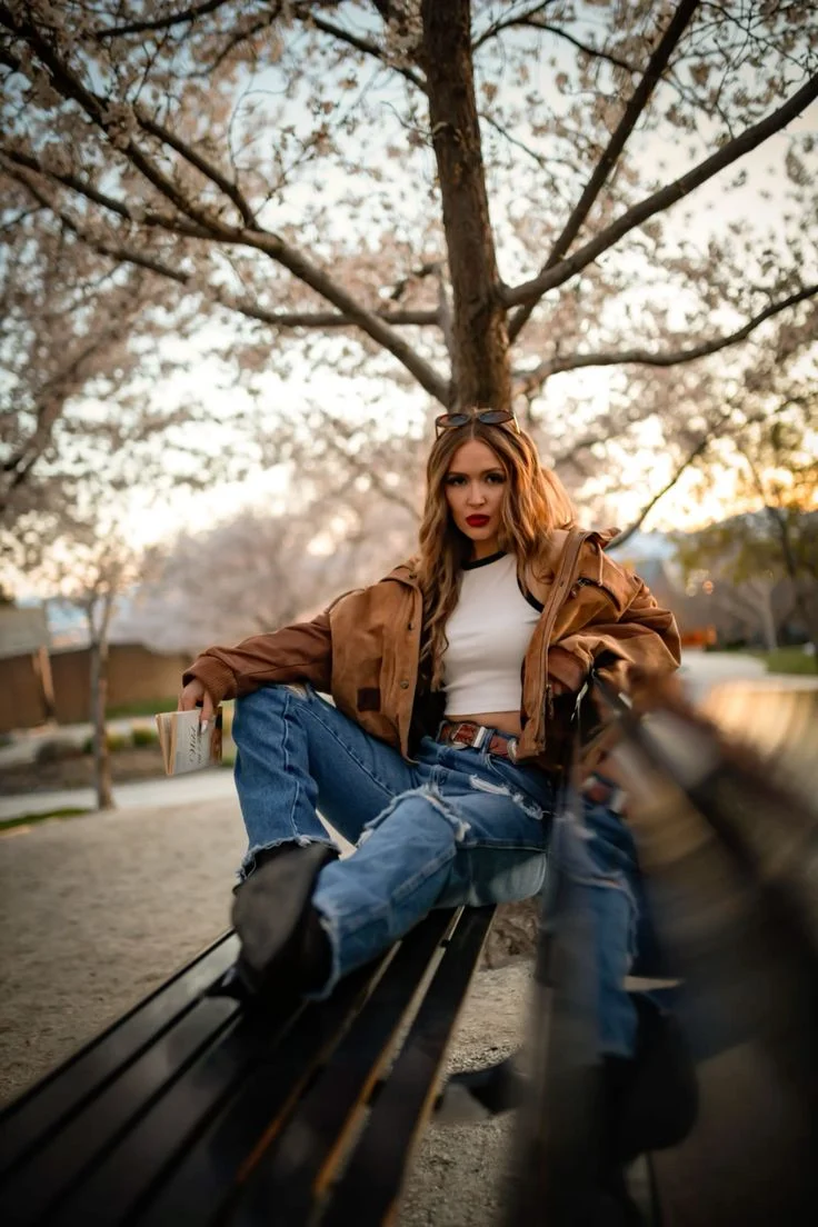 Golden-hour fashion portrait with a relaxed outdoor lifestyle aesthetic for a phone wallpaper.