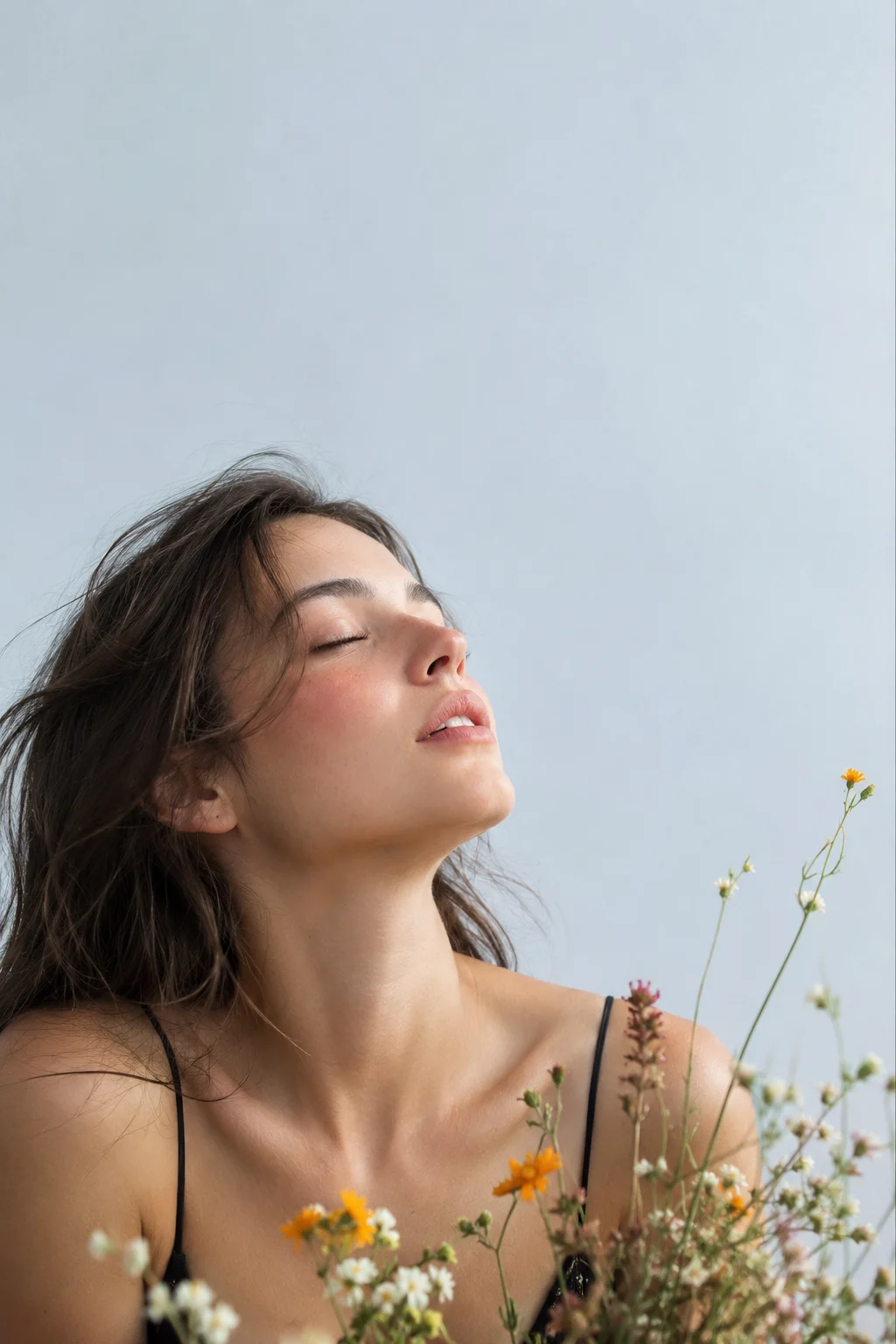 woman in studio, shown with smartphone-style photo styling.