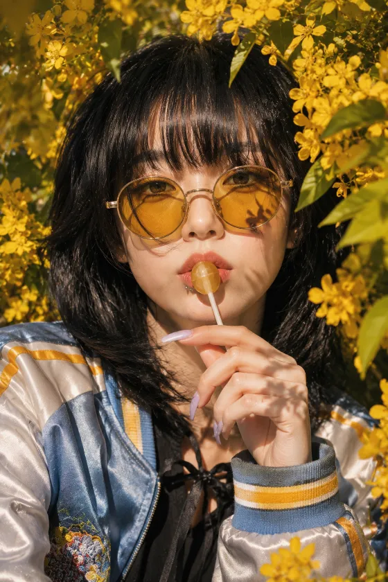 Editorial floral portrait surrounded by golden blossoms in warm afternoon light.