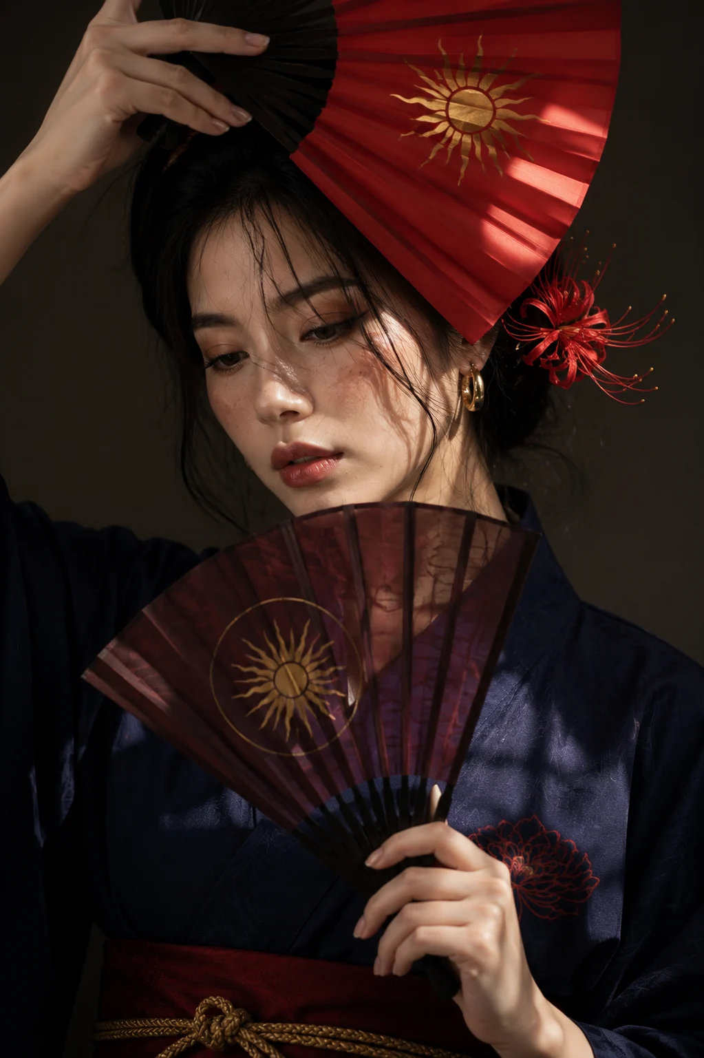 Cinematic beauty portrait with decorative folding fans and dramatic light.