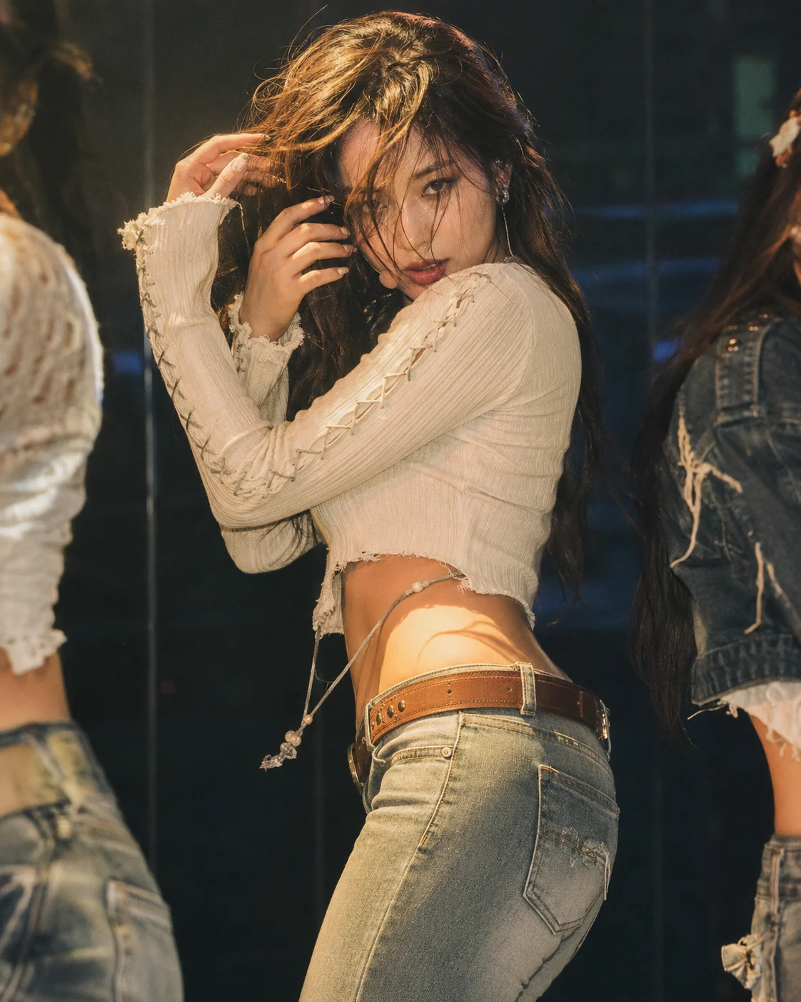 Y2K stage-fashion outfit with a distressed cream crop top, low-rise jeans, golden spotlight, and a confident twisted dance pose.