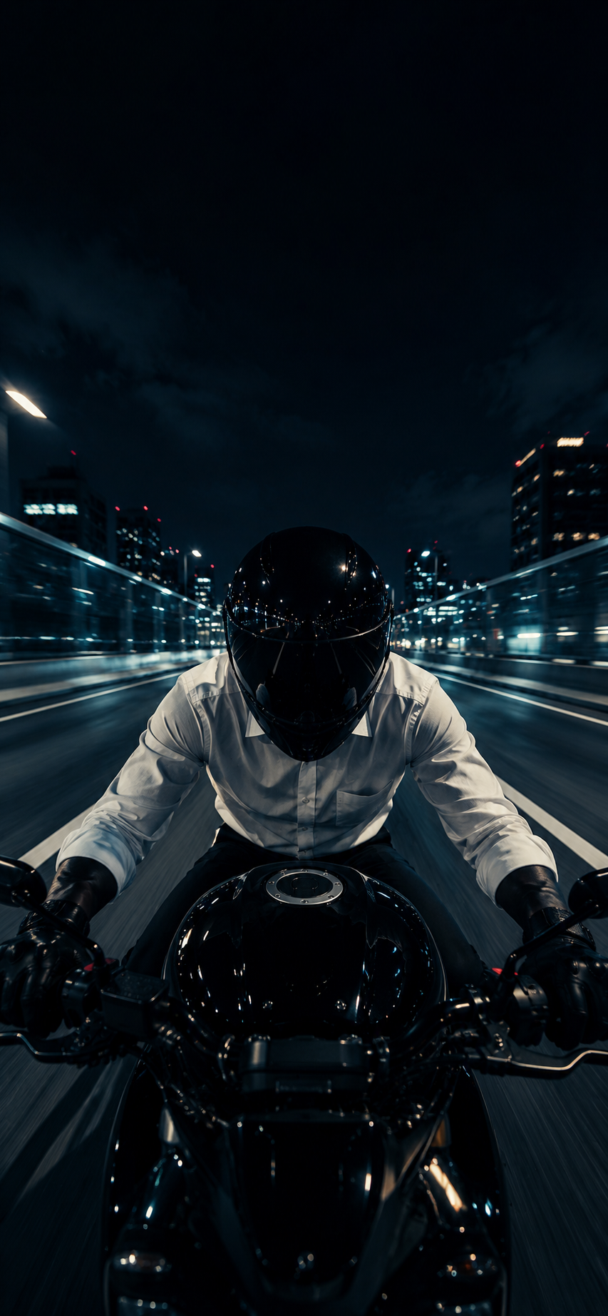 Dark city motorcycle wallpaper showing a helmeted rider on a glossy black bike at night with motion blur.