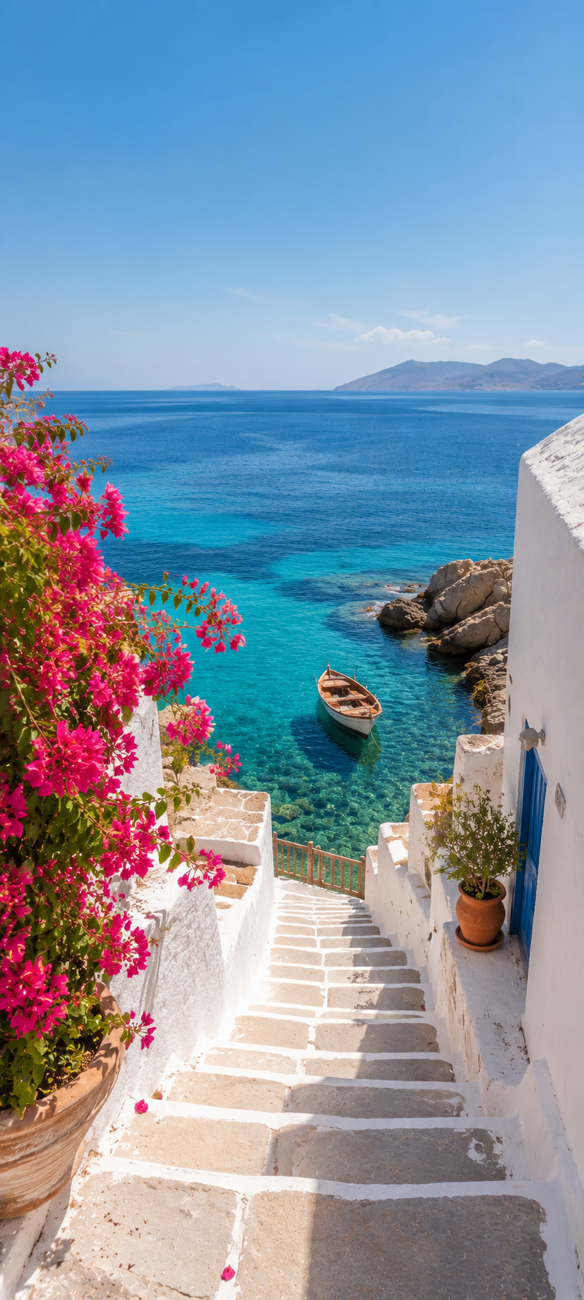 White seaside stairs with pink bougainvillea leading down to turquoise water and a small wooden boat.