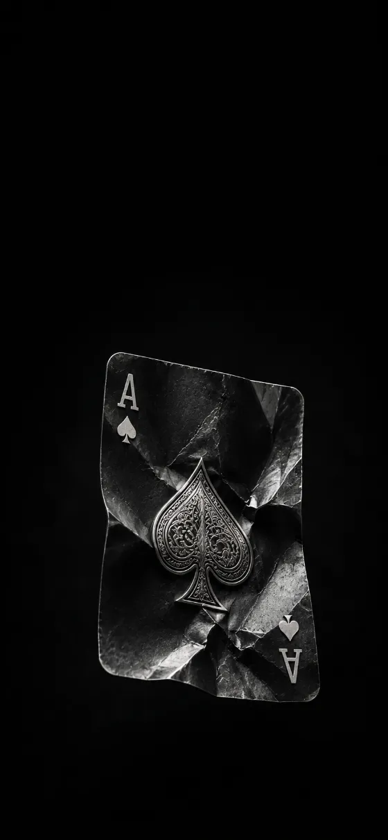 Minimal monochrome Ace of Spades card with folded paper texture on a black background.