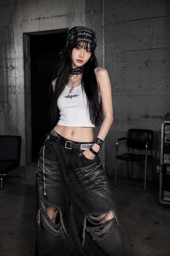 Vertical industrial fashion editorial with long black hair, graphic scarf styling, white crop top, and ripped oversized jeans.
