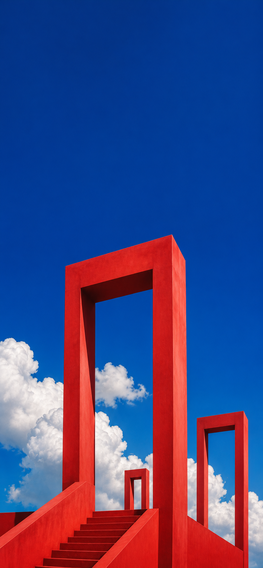 Minimal red architectural frames extending into a vivid blue sky with soft white clouds.