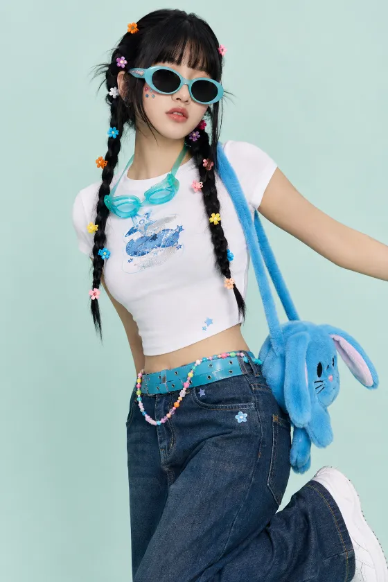 Vertical Y2K fashion portrait with aqua sunglasses, braided pigtails, cropped white tee, dark, colorful, and a blue plush rabbit bag.