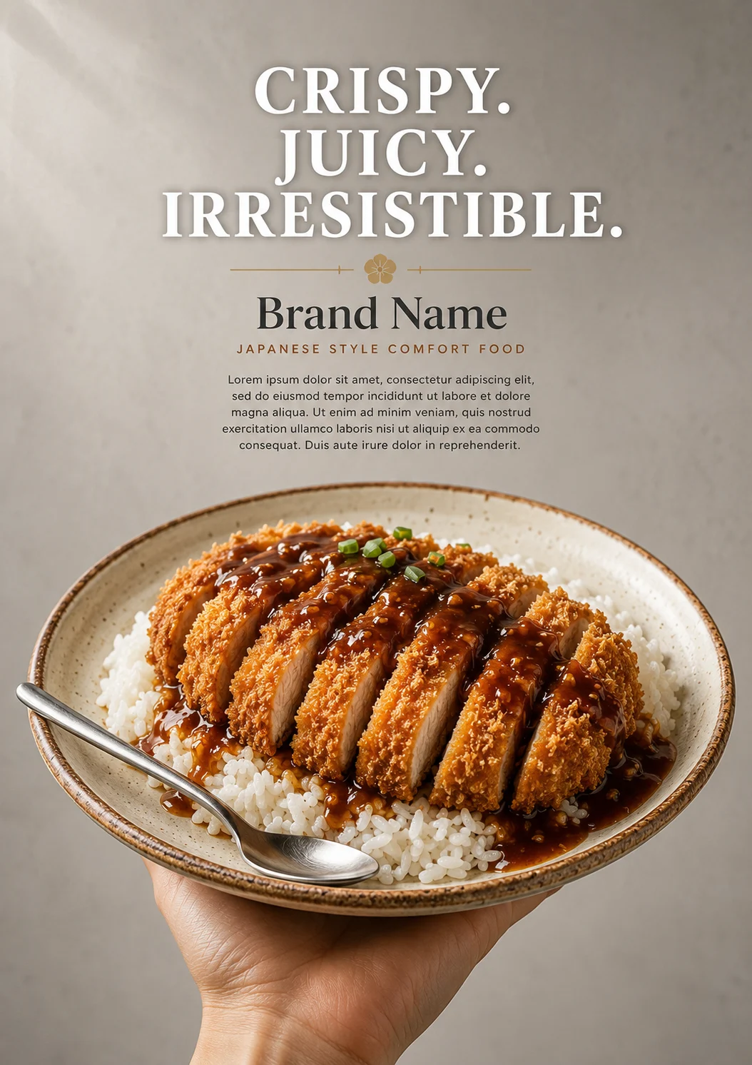 Crispy sliced chicken cutlet served over steamed rice on a ceramic plate held by one hand against a minimalist gray background.