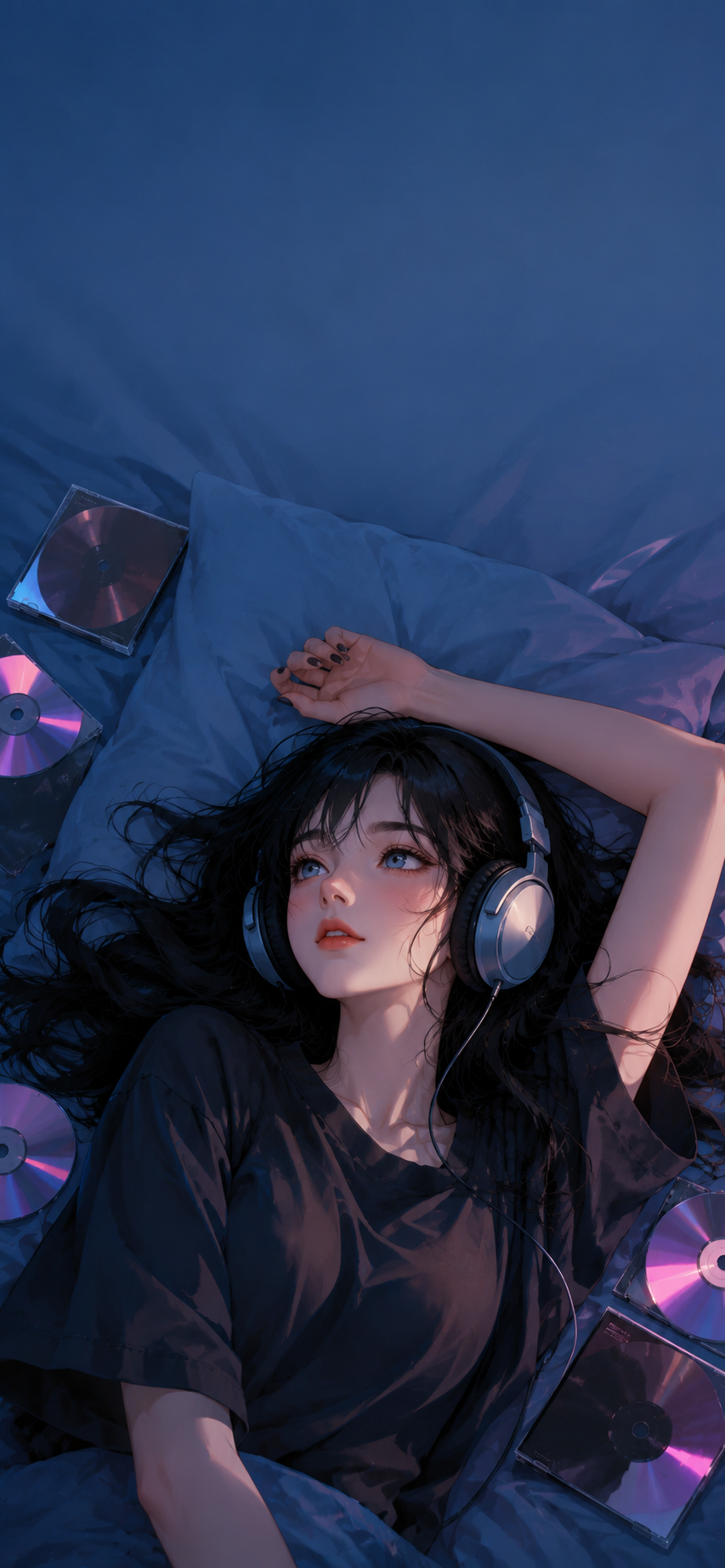 Anonymous woman with long black hair wearing large headphones while reclining on blue bedding among scattered music cases and reflective discs.