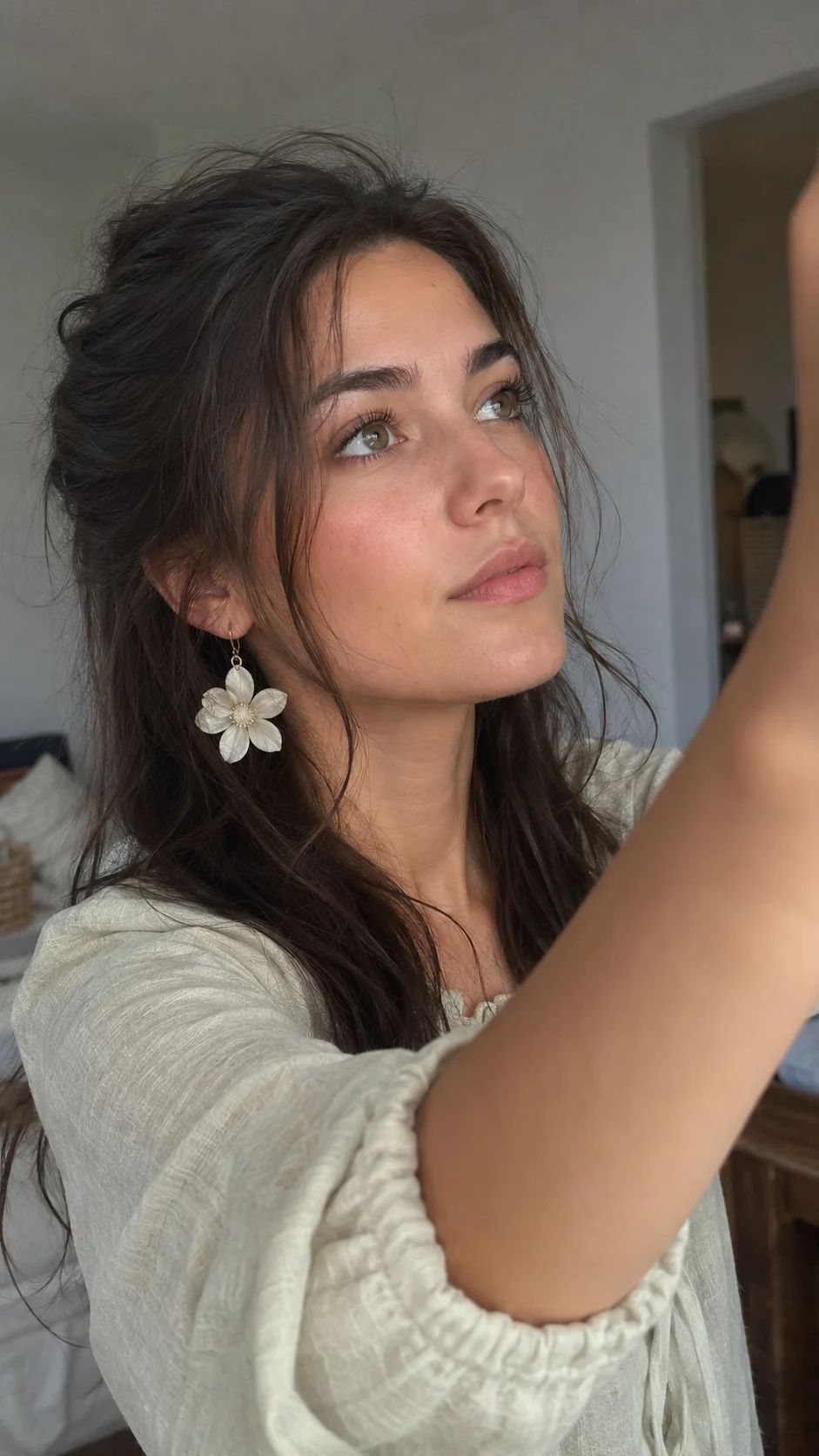 woman in studio, shown with smartphone-style photo styling.