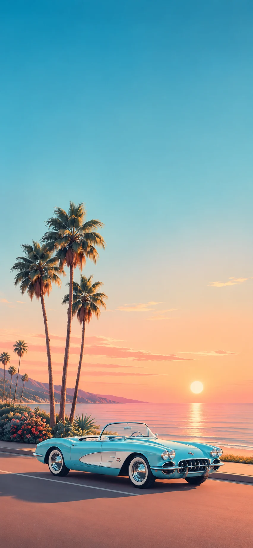 Turquoise vintage convertible parked by the ocean at sunset with palm trees and distant hills behind it.