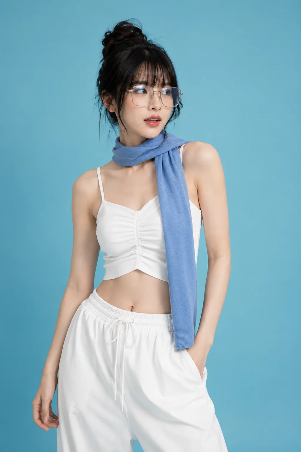 Vertical minimal fashion portrait with white clothing, silver glasses, a blue scarf, and an aqua studio background.